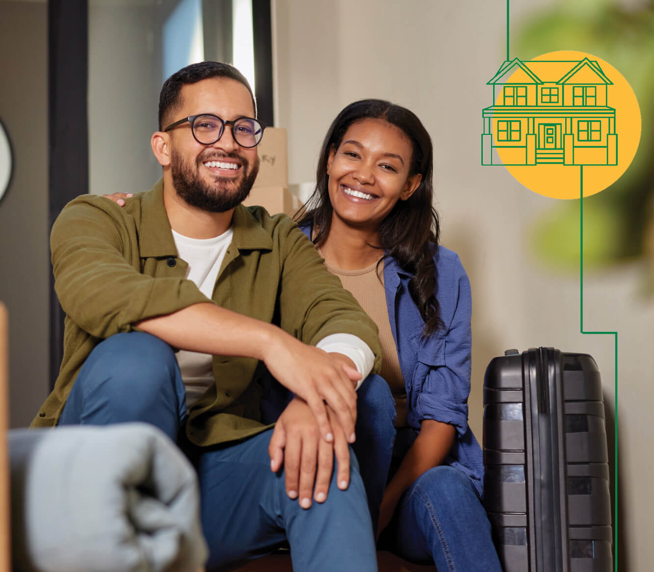 A couple sitting in a room with their luggage ready to apply for a new home loan.