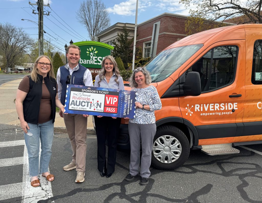 A group shot outside Riverside Industries for the Annual Auction.