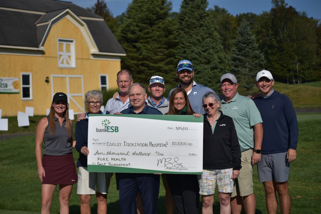 A check donation to Cooley Dickinson Hospital.