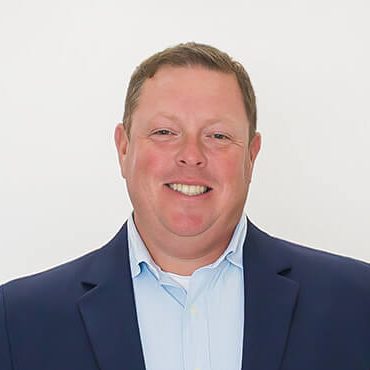 A headshot of Michael Oleksak.