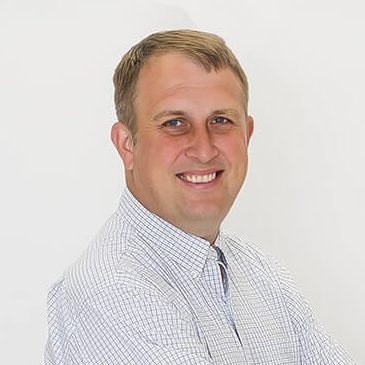 A headshot of Andy Tilbe.