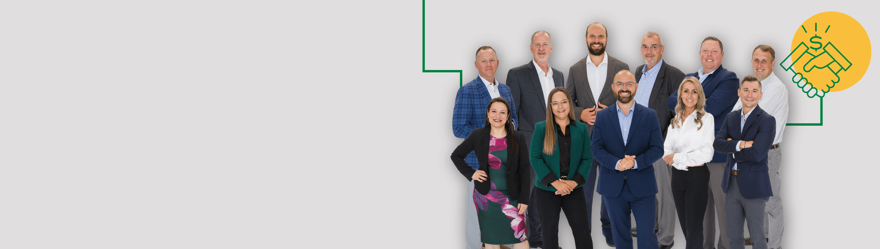 A group shot of our Easthampton team in front of a gray background.