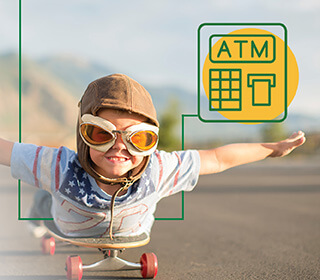 A boy with a helmet and goggles on riding on a skateboard with his arms out.