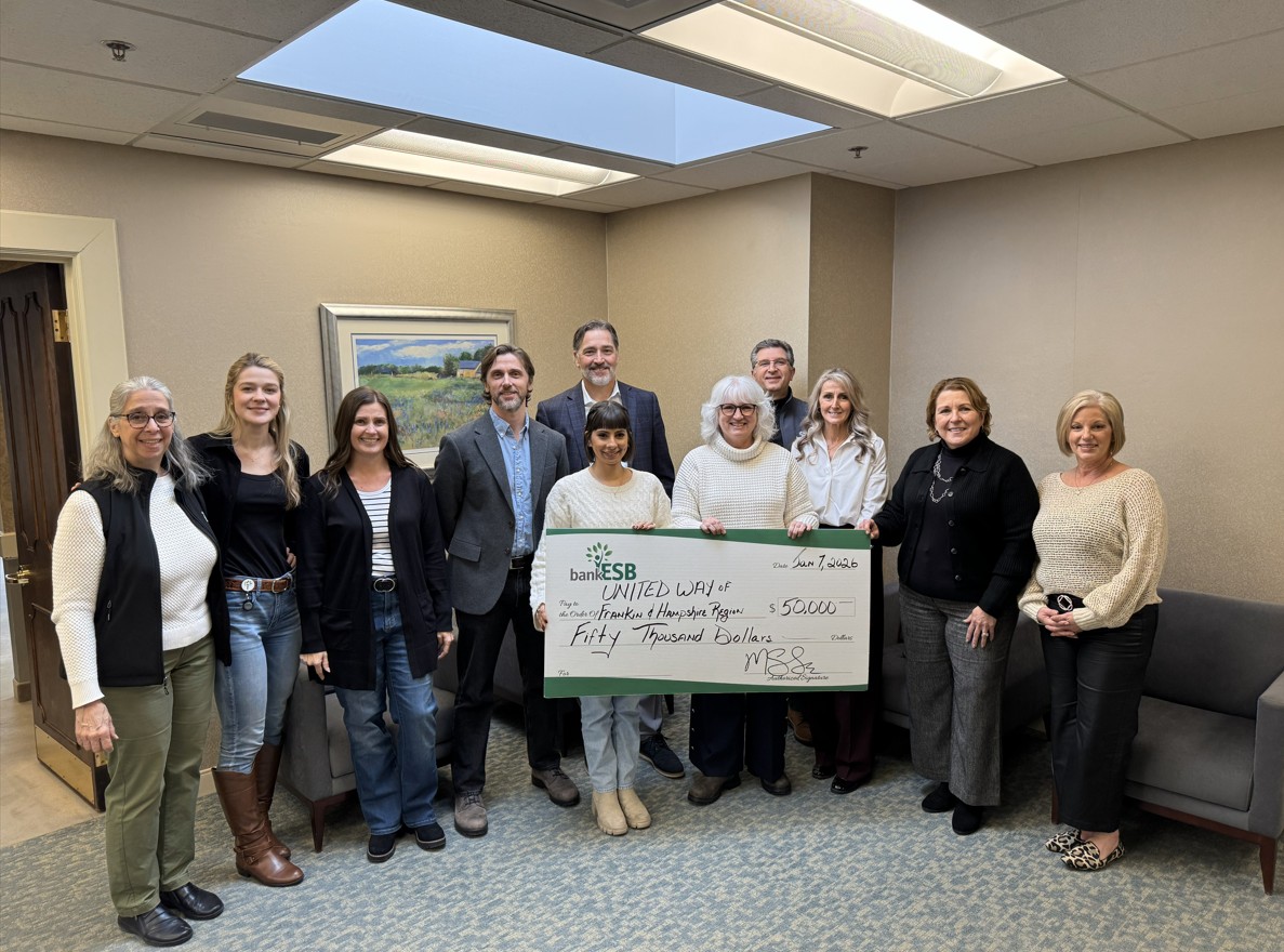 A check presentation for a donation of $50,000 to local organization, United Way.