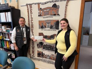 A check donation to Belchertown High School from from our charitable giving program, The Giving Tree. 