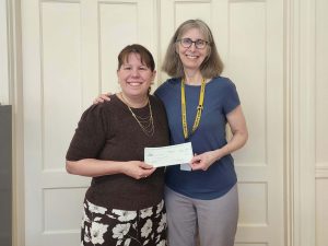 A check donation to Hadley Public Schools from our charitable giving program, The Giving Tree. 